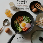 chef cooking with a wok over high flame