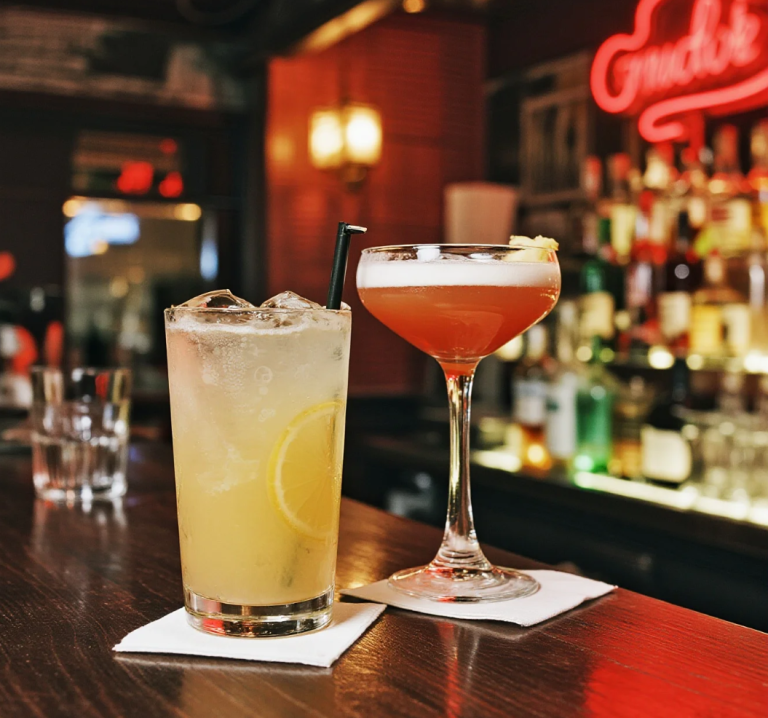 Stylish cocktail bar and energetic nightclub showcasing different nightlife vibes